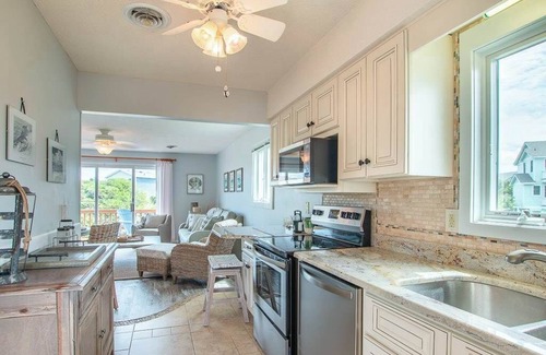 Sea Acres House | Georgetown Sands condo with WiFi, outdoor shower, and access to community pool and tennis