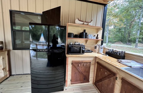 Newnata RV Rental | Glamping in an Authentic Style Sioux Tipi in the Heart of the Ozarks “The Deer”