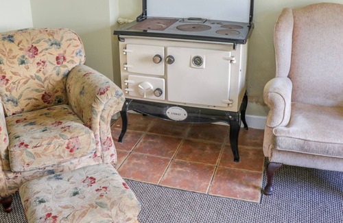 Inishmacatreer Cottage | GLOR COTTAGE, pet friendly, with a garden in Knock, County Mayo