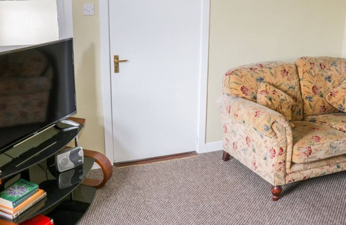Inishmacatreer Cottage | GLOR COTTAGE, pet friendly, with a garden in Knock, County Mayo