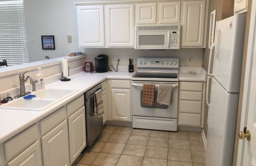 Sunset Beach Condo | GOLF COURSE CONDO - POND VIEWS & FREE NETFLIX