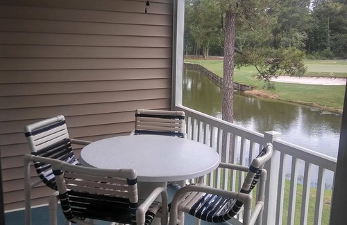 Sunset Beach Condo | GOLF COURSE CONDO - POND VIEWS & FREE NETFLIX