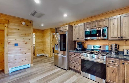 Carrabassett Valley Cabin | Gorgeous dog-friendly cabin with great view, deck, hot tub, & gas fireplace