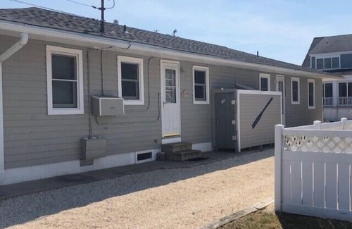 Stone Harbor House | Great location. This ranch style duplex features two bedrooms and one bath. Window air conditioning and nice patio with gas grill, table and chairs. Off street parking. Just a short stroll to the beach and all that Stone Harbor has to offer! Pe