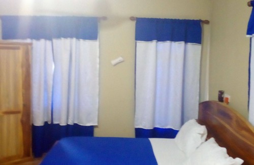 Ashanti Region House | Green Square Guest House is a house with eight private bedrooms each with its.