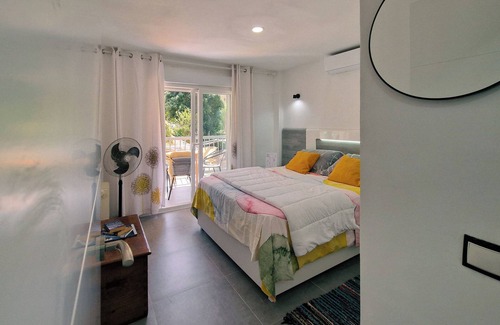Rincon de Loix Apartment | Green Tree Suite with nice garden and pool balcony views in Benidorm