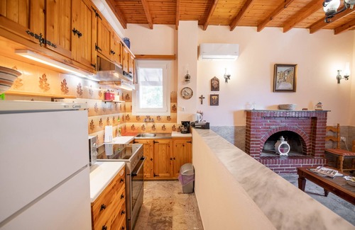 Ano Korakiana House | Green Walnut Home in Ano Korakiana is surrounded by nature on a quiet area.