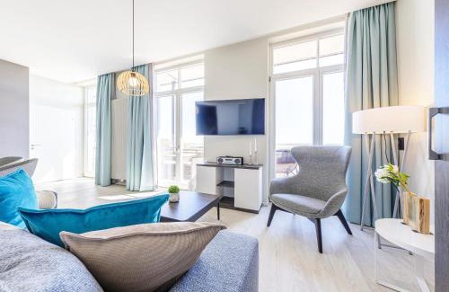 Ostseebad Wustrow Apartment | Große Welle - Moderne 2,5-Zimmer Ferienwohnung mit Südbalkon und Boddenblick