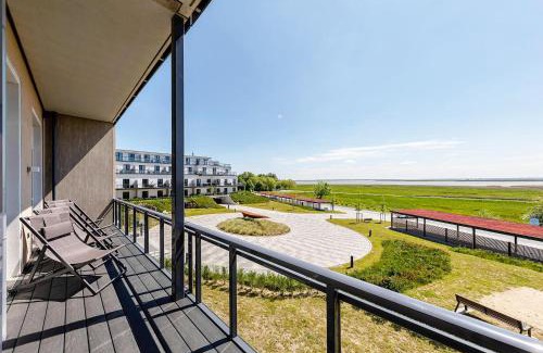 Ostseebad Wustrow Apartment | Große Welle - Moderne 2,5-Zimmer Ferienwohnung mit Südbalkon und Boddenblick