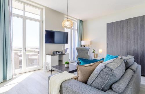 Ostseebad Wustrow Apartment | Große Welle - Moderne 2,5-Zimmer Ferienwohnung mit Südbalkon und Boddenblick
