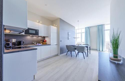 Ostseebad Wustrow Apartment | Große Welle - Moderne 2,5-Zimmer Ferienwohnung mit Südbalkon und Boddenblick