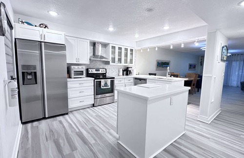Cocoa Beach Condo | Ground Floor Open Modern, Architecturally Redesigned Just Steps from the Beach.
