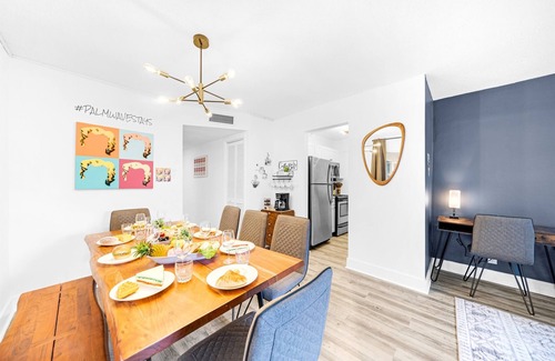 Survey Creek Apartment | Ground Floor - Water View - Palm Wave Says