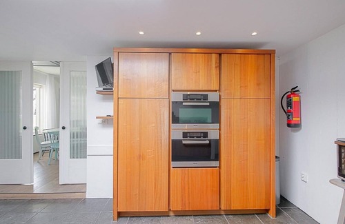 Municipality of Den Helder House | Group accommodation Villa Pakhuys: Cozy and spacious accommodation with private pool in Julianadorp aan Zee