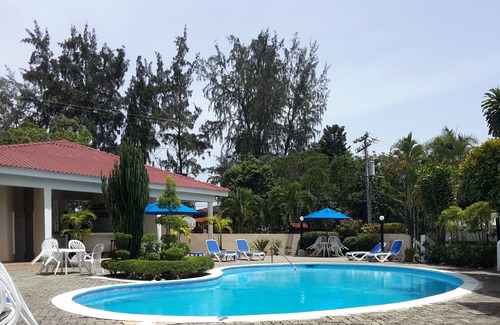 El Batey Apartment | Guest-friendly 2-BD central condo near beach, with pool, Wi-Fi, cable TV