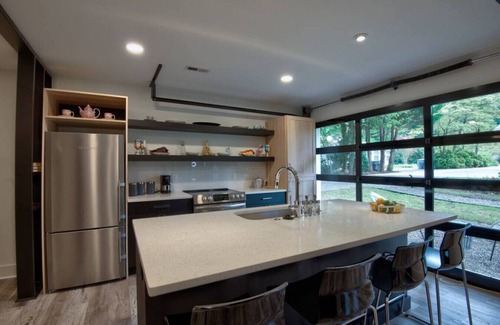 Charlotte House | Guest house · Ultra Modern open w/retractable glass garage door