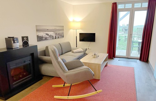 Wremen Apartment | Hübsche, Strandnahe Ferienwohnung mit Eigener Sauna und Terrasse mit Strandkorb