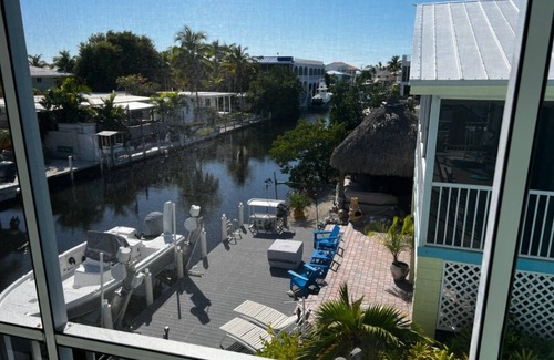 Long Key House | Happy "Key-z " canal-front home w/Tiki hut- RV storage available.