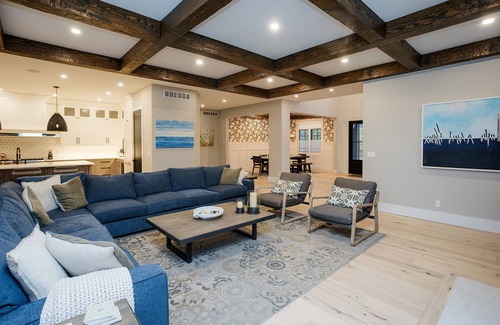 Grand Beach House | Heated pool, porch w/fireplace, close to beach & park, 6 per golf cart included
