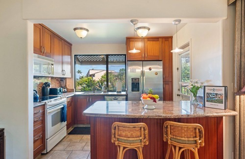 Kihei Condo | Hidden Gem: 1BD/2BA with Ocean Views Visible Through Lush Tropical Surroundings