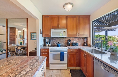 Kihei Condo | Hidden Gem: 1BD/2BA with Ocean Views Visible Through Lush Tropical Surroundings