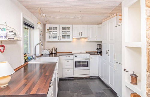 Hjarbæk House | High up, with a fantastic view of the fjord, is this beautiful cottage that provides the setting for