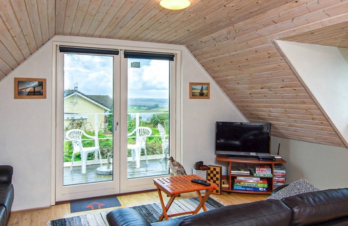 Hjarbæk House | High up, with a fantastic view of the fjord, is this beautiful cottage that provides the setting for