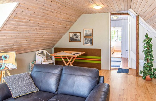 Hjarbæk House | High up, with a fantastic view of the fjord, is this beautiful cottage that provides the setting for