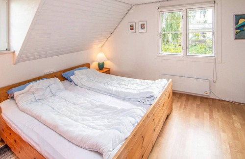 Hjarbæk House | High up, with a fantastic view of the fjord, is this beautiful cottage that provides the setting for