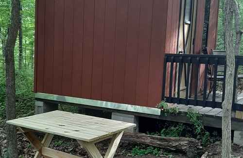 Mineralwells Cabin | Hike to your tiny cabin in the woods, we will leave the solar lights on for you.