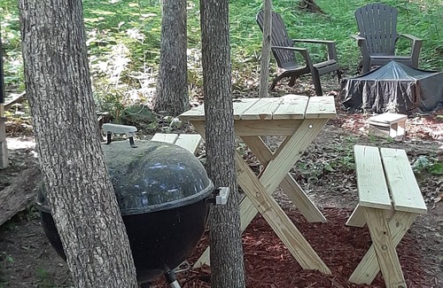 Mineralwells Cabin | Hike to your tiny cabin in the woods, we will leave the solar lights on for you.