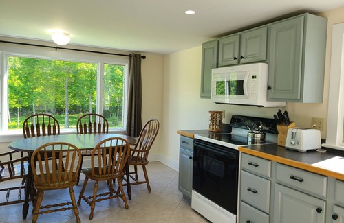 Sandwich House | Hillside home minutes to Center Sandwich and Moultonboro. Single floor living.