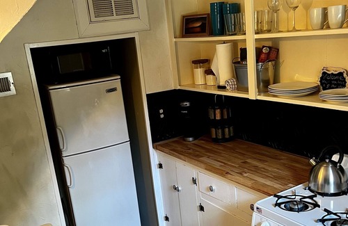 Gastonia House | Historic 20s Cottage sits under the breath taking oaks.