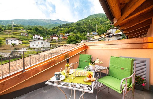 Musso Apartment | Holiday Apartment "Orchidea Terrazzo Sul Tetto" with Balcony, Shared Pool & Wi-Fi