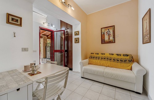 Portoscuso House | Holiday Home 'Casa Di Rita' with Shared Pool, Private Terrace and Air Conditioning