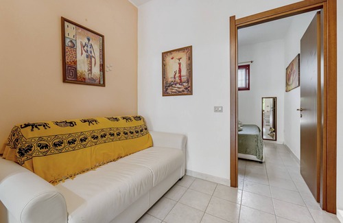 Portoscuso House | Holiday Home 'Casa Di Rita' with Shared Pool, Private Terrace and Air Conditioning