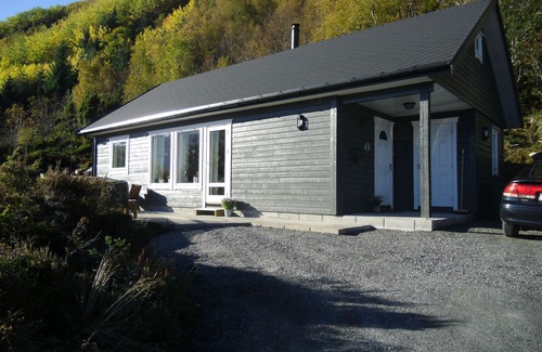 Hareid Cabin | Holiday home with view plot beyond Fjord and mountains.