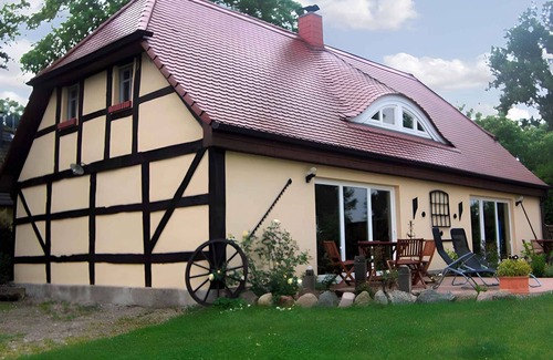 Garz/Rugen House | Holiday home with fireplace, patio and a view of nature