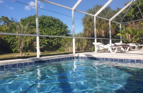 Port Charlotte Villa | Holiday villa with an extra large heated private pool and terrace area