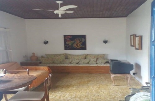 Balneario Remanso House | home Beach Center, wooded and grassy yard with fruit trees.