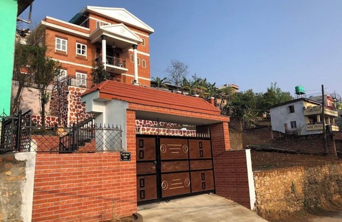 Kirtipur House | Home is located on the side of a mountain near a famous Buddhist monastery. n