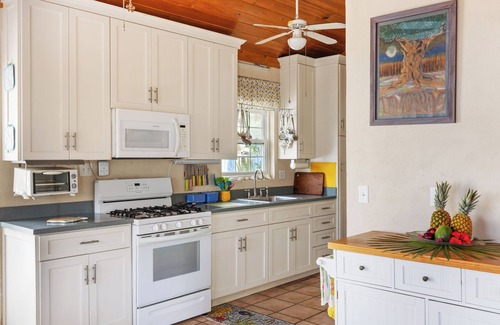 Gregory Town Villa | Home overlooking Gregory Town's famous Cove. Beach chairs and SUP included