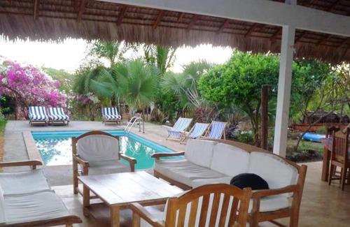 Nosy Be House | Homerez - Bungalow for 4 ppl. with shared pool, sea view and garden at Andilana