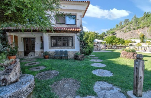 Sao Joao Batista House | Homerez - Charming House in Porto de Mós with Shared Pool