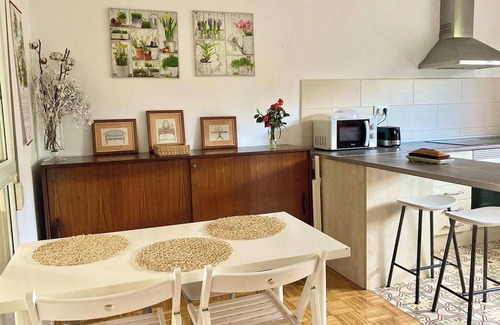 Aviles House | Homerez - Charming House in Bastian, Garden