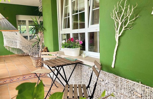 Aviles House | Homerez - Charming House in Bastian, Garden
