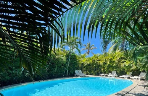Sainte-Rose House | Homerez - House for 4 ppl. with shared pool, sea view and garden at Sainte-Rose