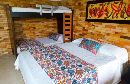 Calarca House | Hotel Chalet San Juan de Ticlan