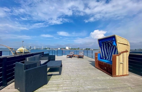 Ostholstein Boat Rental | House Boat 'Annis Mehrblick' with Sea View, Private Terrace and Wi-Fi