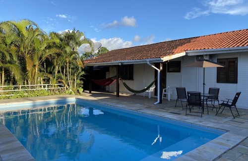 Cananeia House | House in Cananéia with swimming pool and barbecue area